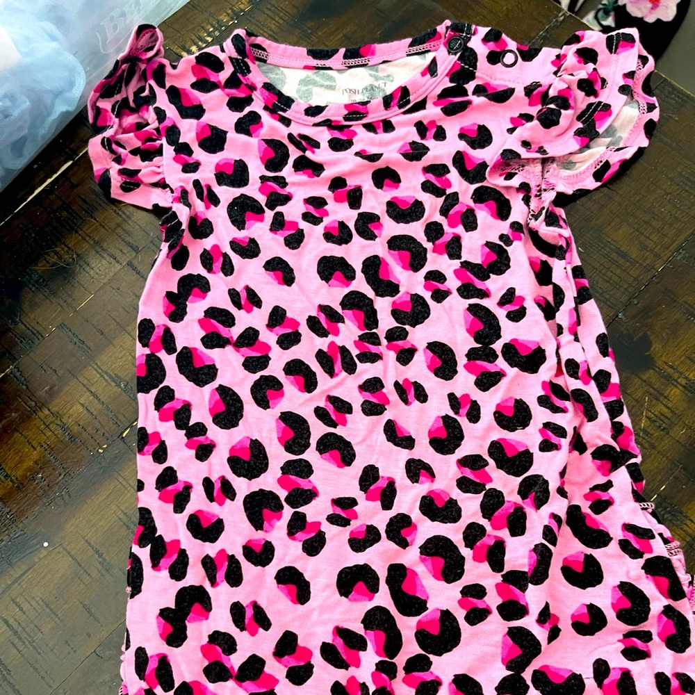 Gently used 18-24 month posh peanut one piece! Pink animal print hard to find.